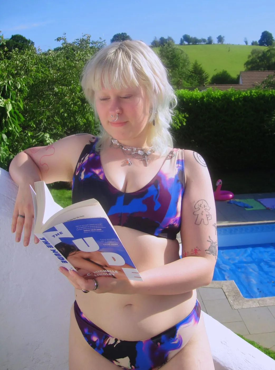 Crazy Goose — purple marbled bikini, poolside reading